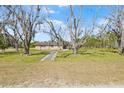 Sprawling front yard with a well-maintained lawn and a charming brick house at 4305 Hamilton Rd, Lakeland, FL 33811