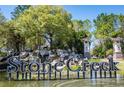 Stone Creek entrance sign with water feature and decorative architectural elements at 6898 Sw 95Th Cir, Ocala, FL 34481