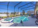 Backyard pool with attached spa and screened enclosure at 622 Copeland Dr, Haines City, FL 33844