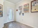 Bright entryway featuring wood-look tile flooring and natural light from the front door at 3926 Grassland Dr, Orlando, FL 32824