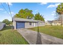 Charming single story home featuring an attached garage, new paint, and a well maintained lawn at 5728 Ne 21St Avenue Rd, Ocala, FL 34479