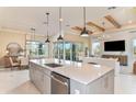 Spacious open-concept kitchen with a large center island, stainless appliances, and a view of the living area at 9245 Sw 52Nd Place Rd, Ocala, FL 34481