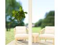 Cozy patio with comfortable seating and a serene outdoor view at 2628 Armstrong Ave, Clermont, FL 34714