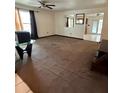 Cozy living room with carpet flooring and natural light, offering a comfortable space for relaxation at 1527 E Elm Rd, Lakeland, FL 33801