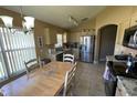 Bright kitchen featuring stainless steel appliances, granite countertops, and a breakfast nook at 1124 Liberty Hall Dr, Kissimmee, FL 34746