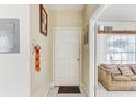 Welcoming entryway with neutral walls, tile flooring, and a view of the living room at 4524 Oak Arbor Cir, Orlando, FL 32802