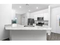 Modern kitchen with stainless steel appliances and granite countertops at 13279 Tula Loop, Astatula, FL 34705