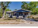 Charming single-story home featuring a screened-in porch and mature trees in a serene neighborhood at 4290 Trainer Rd, Bartow, FL 33830