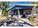 Charming single-story home featuring a screened-in porch and mature trees in a serene neighborhood at 4290 Trainer Rd, Bartow, FL 33830
