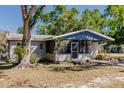 Charming single-story home featuring a screened-in porch and mature trees in a serene neighborhood at 4290 Trainer Rd, Bartow, FL 33830