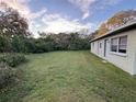 Expansive backyard offering plenty of space for outdoor activities and privacy at 203 Glenwood Dr, Lakeland, FL 33805