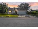 Charming single-Gathering home featuring a two-car garage and a well-maintained front yard at 326 Sand Pine Trl, Winter Haven, FL 33880