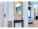 Entryway features a decorative mirror, table, and decor. Bedroom visible in the background at 829 E Lime St, Lakeland, FL 33801