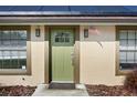 Close-up of a front door with an American flag accent and modern outdoor lighting at 5235 Nichols E Dr, Lakeland, FL 33812