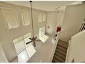 Bright living room with high ceilings, large windows, and tile floors, perfect for entertaining at 539 Lakeview Dr, Poinciana, FL 34759