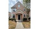 Inviting two-story house with a covered entrance and a well-maintained walkway at 3337 Soho St # 103, Orlando, FL 32835