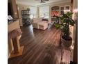 Cozy living room with hardwood floors, neutral walls and plenty of sunlight at 3337 Soho St # 103, Orlando, FL 32835