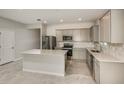 Spacious kitchen featuring stainless steel appliances, gray cabinetry and a center island at 8249 Sw 52Nd Lane Rd, Ocala, FL 34481