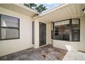 Private patio with stone pavers, perfect for outdoor entertaining at 2249 Cypress Cove Dr # E3, Tavares, FL 32778