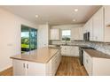 Well-lit kitchen boasts stainless steel appliances and a spacious center island at 5831 Sw 87Th Ave, Ocala, FL 34481