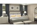 Comfortable bedroom with plush bedding, stylish decor, and ample natural light from the windows at 1887 Clear Sky Dr, Kissimmee, FL 34744
