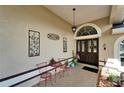 Cozy front porch with decorative elements, outdoor seating, and a welcoming entrance at 7402 Gunstock Dr, Lakeland, FL 33809