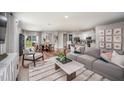 Open-concept living room flows into the dining and kitchen areas, perfect for entertaining at 2004 Marigold Aly, Winter Haven, FL 33884
