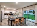 Eat-in dining room showcases sliding glass doors to the backyard and connects to a well-equipped kitchen at 2212 Canyon Oak Dr, Davenport, FL 33837