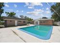 Private backyard pool with a concrete patio, perfect for outdoor entertaining at 930 29Th Nw St, Winter Haven, FL 33881