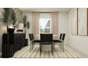 Contemporary dining room with stylish black chairs and elegant decor at 1311 Blue Ash Ln, Deland, FL 32720
