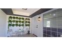 Inviting entrance featuring potted plants on the wall and a small table with chairs at 25322 Columbia Cir, Lake Wales, FL 33898