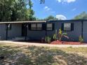 Cozy home with well-kept lawn and black shutters giving a quaint, inviting feel at 5580 Hwy 542 W, Winter Haven, FL 33880