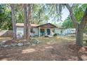 Quaint single-story home featuring a brick exterior, covered entry, and mature landscaping for curb appeal at 3365 Bahama Ct, Lake Wales, FL 33898