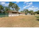 A charming home with a well-maintained lawn and inviting curb appeal at 933 W Queen St, Lakeland, FL 33803