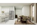 Open dining area with modern decor, stylish furnishings, and neutral color palette at 971 Hour Glass Rd, Lakeland, FL 33801