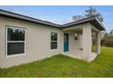 A spacious back porch area leads into this modern one-story home with natural lighting at 16538 Sw 31St Terrace, Ocala, FL 34473