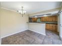 Cozy dining area featuring decorative lighting, and views into the breakfast bar and kitchen at 2500 21St Nw St # 71, Winter Haven, FL 33881