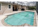 Sparkling screened-in pool and patio area offers a relaxing outdoor space for entertainment at 10292 Kristen Park Dr, Orlando, FL 32832