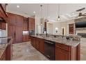 Gourmet kitchen with granite counters, custom cabinets and stainless steel appliances at 12329 Sw 140Th Loop, Dunnellon, FL 34432