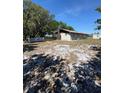 Exterior view of the property featuring a large propane tank, providing ample space for outdoor activities at 8955 Rhoden Loop W Rd, Fort Meade, FL 33841