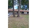 Charming single-story home with a brick facade and attached garage at 3400 Ne 43Rd Pl, Ocala, FL 34479