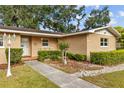 Inviting front exterior of a single-story home with cozy front porch decor at 4915 Whiteoak E Dr, Lakeland, FL 33813