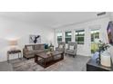 Cozy living room with comfortable seating, stylish decor, and ample natural light at 611 Terrapin Dr, Debary, FL 32713