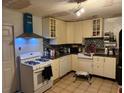 Functional kitchen features white cabinetry, modern appliances, and tile backsplash at 612 Acapulca Way, Altamonte Springs, FL 32714