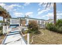 This unique beachside cottage features nautical-themed details and a welcoming walkway at 370 Hartford Ave, Daytona Beach, FL 32118