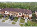 Aerial view of the townhome complex showcasing the well maintained landscaping and ample parking at 6109 Apollos Corner Way, Orlando, FL 32829