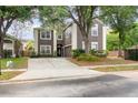 Two-story home with brown siding, white trim, attached two-car garage and concrete driveway at 1300 Holly Glen Run, Apopka, FL 32703
