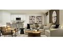 Open-concept living room featuring modern décor, comfortable seating, and a view of the kitchen at 1323 Blue Ash Ln, Deland, FL 32720