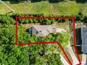 Aerial view of a home with fenced backyard and mature trees at 156 Oak Grove Rd, Winter Park, FL 32789