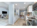Bright kitchen with stainless steel appliances, white cabinets, and modern countertops at 820 Lamp Post Ln, Lakeland, FL 33809